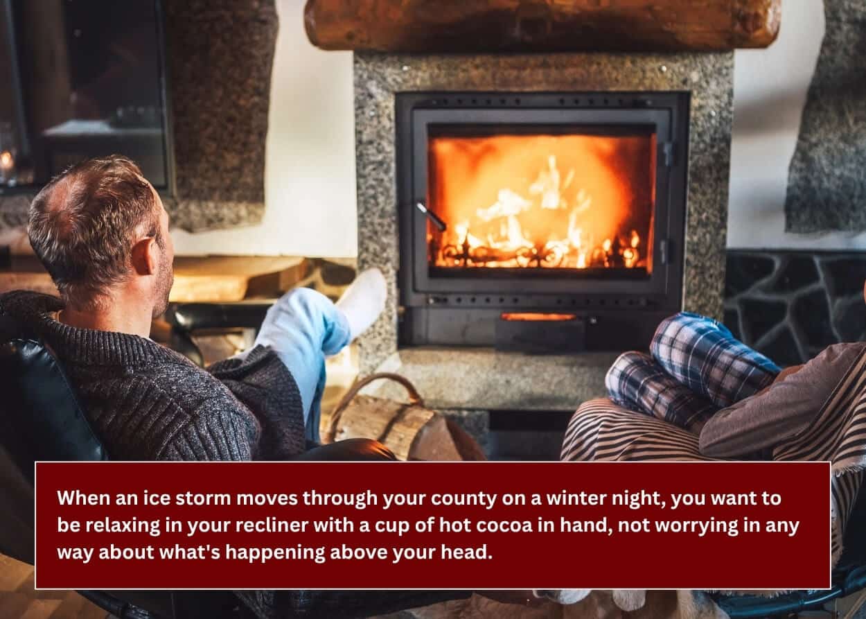 Homeowners relaxing by a fireplace after planning ahead for a long-lasting roof