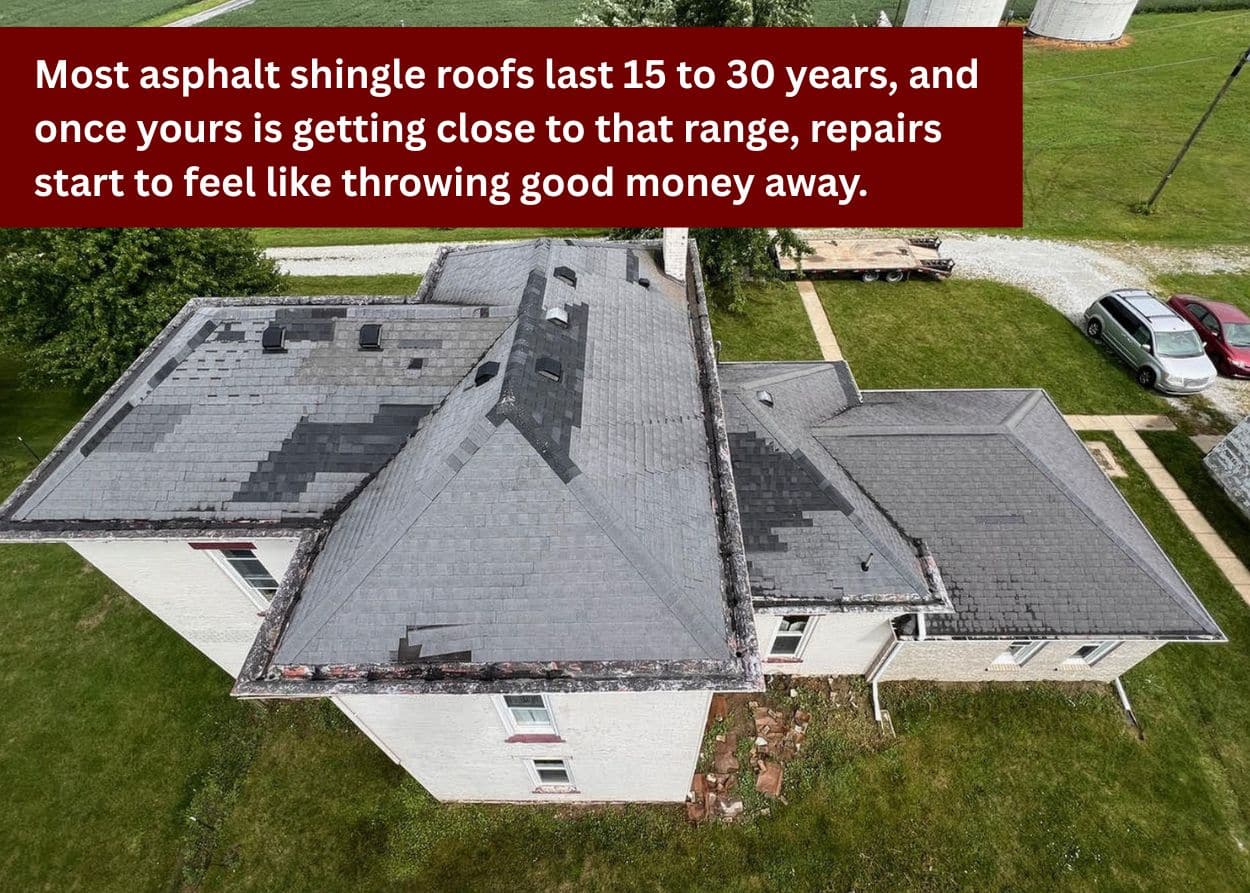 Aerial view of an aging asphalt shingle roof showing widespread wear, discoloration, and multiple repaired sections.